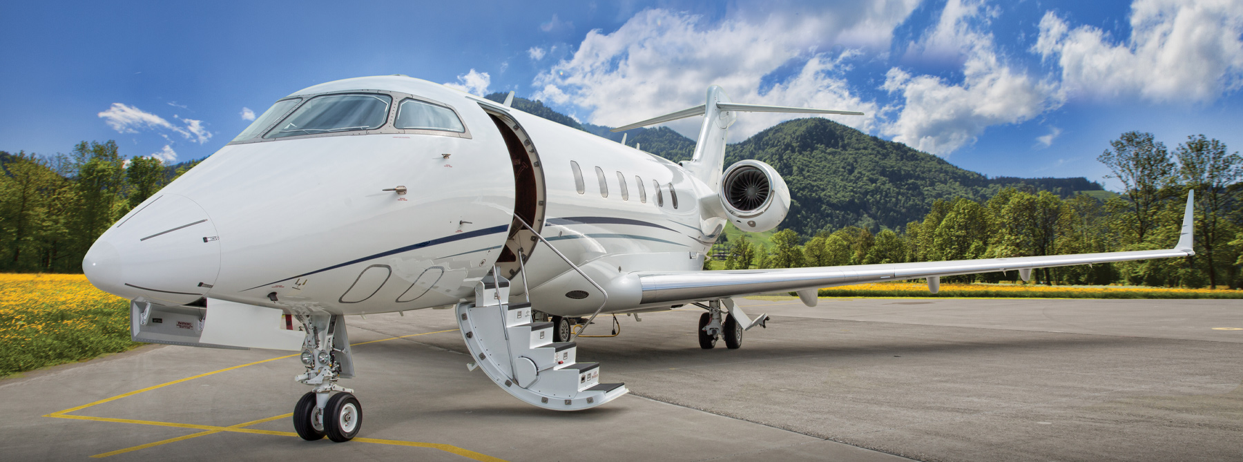 A private jet sitting on a runway with the stairs down